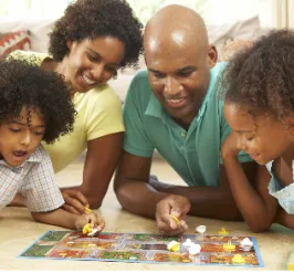 Family playing a board game