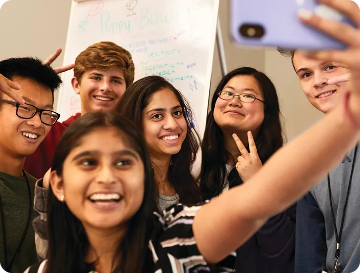 group of teens taking a selfie